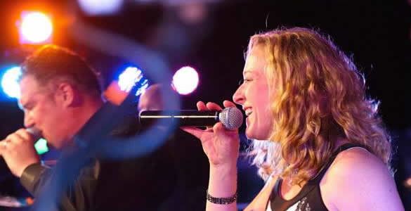 Woman singing on stage