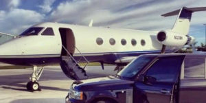 Private Jet on Runway with Car